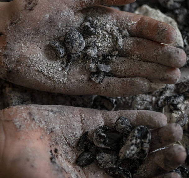 burnt ash in the hands of a teenager close -up. concept - Photo, Image