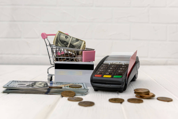 Toy cart with dollar, credit card and banking terminal - Photo, Image