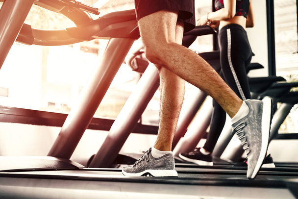 Close up foot  Fitness man running on track treadmill, exercise fitness. - Valokuva, kuva