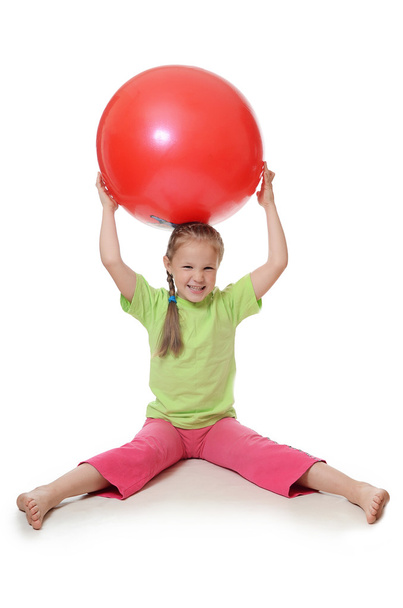 Little girl with a gymnastic ball - Фото, зображення