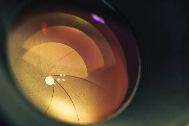 Beautiful camera lens with orange  light of glass. Background pattern for design.	 - Valokuva, kuva