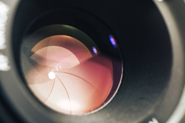 Beautiful camera lens with pink light of glass. Background pattern for design.	 - Foto, afbeelding