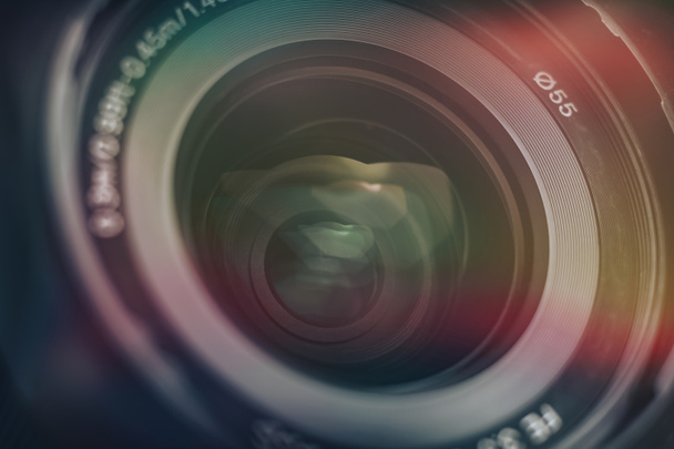 Beautiful camera lens with multi colored light of glass. Background pattern for design.	 - Valokuva, kuva