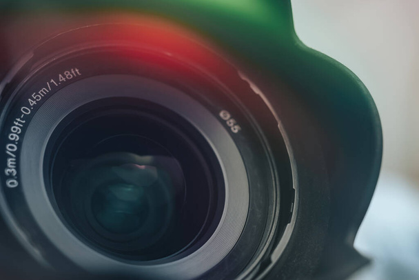 Beautiful camera lens with multi colored light of glass. Background pattern for design.	 - Photo, Image