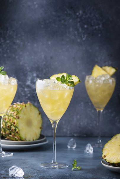 Summer cool cocktail with pineapple, ice and mint, selective focus image - 写真・画像