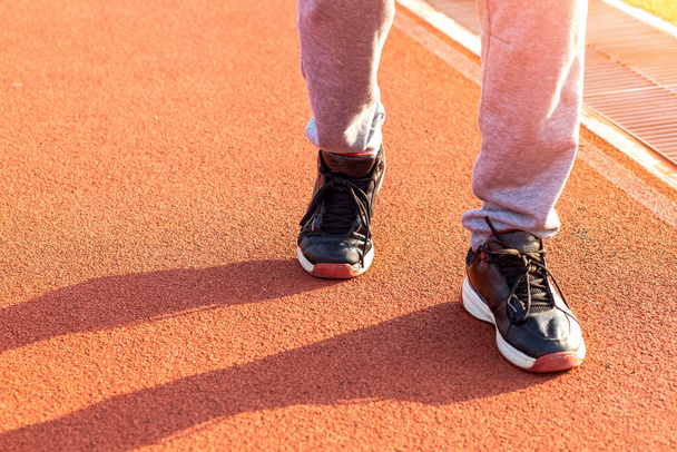 Sport Man jogging or exercise on track race at Stadium.Sport concept. - Fotó, kép