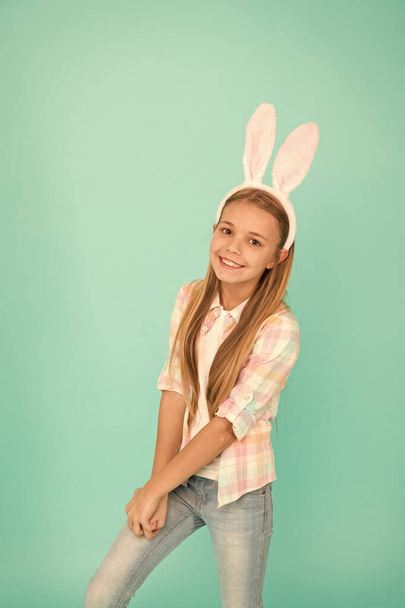 Cute bunny. Holiday bunny girl posing with cute long ears. Child smiling play bunny role. Happy childhood. Traditions for kids to help get in easter spirit. Bunny ears accessory. Easter activities - Fotografie, Obrázek