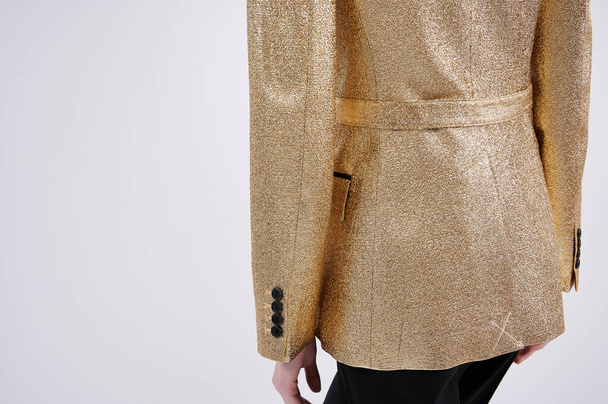 Person in golden jacket. Luxury stylish classic clothes. Made of lurex thread. Individual tailoring. - Photo, Image