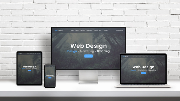 Presentación del concepto de agencia de diseño web en pantallas de diferentes dimensiones. Plantilla de diseño web plana moderna, concepto de tema. Muro de ladrillo blanco en fondo
 - Foto, Imagen
