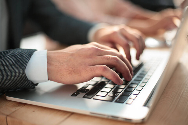close up. businessman typing on laptop keyboard. - Fotografie, Obrázek