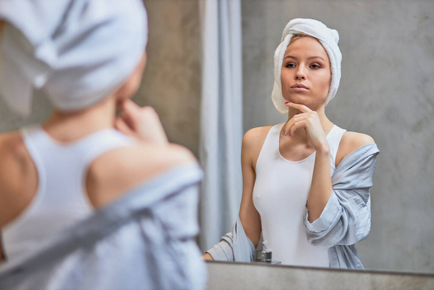 adorable caucasian woman with towel on head in bathroom - Foto, Bild