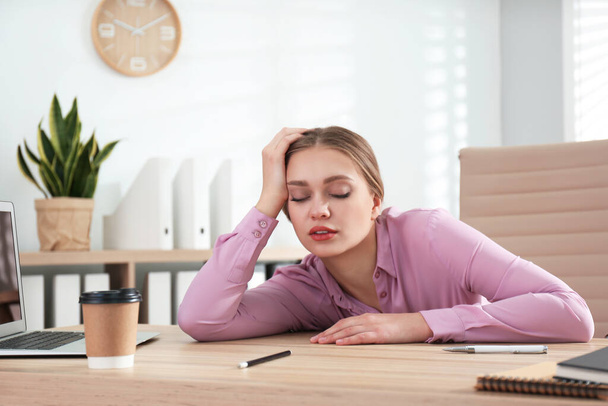 Lazy office worker sleeping at desk indoors - Photo, Image