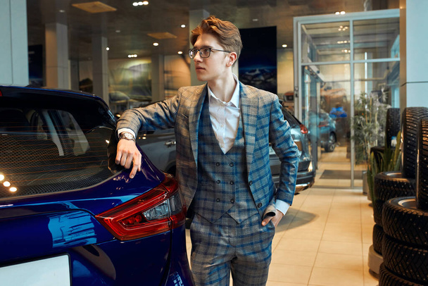 young good looking man advertising a new car - Φωτογραφία, εικόνα