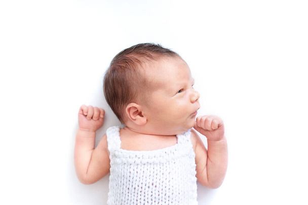 Newborn baby emotions, white background. Funny face of a child, emotions. vertical collage  - Photo, Image