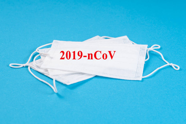 Surgical mask protective mask with text 2019-nCoV .Chinese Coronavirus, wuhan virus. - Valokuva, kuva