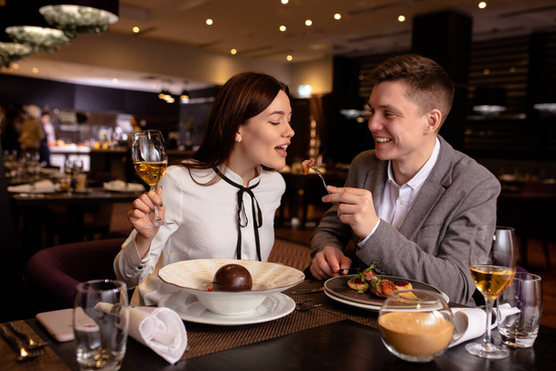 happy couple have dinner, dating in restaurant - Foto, Imagem