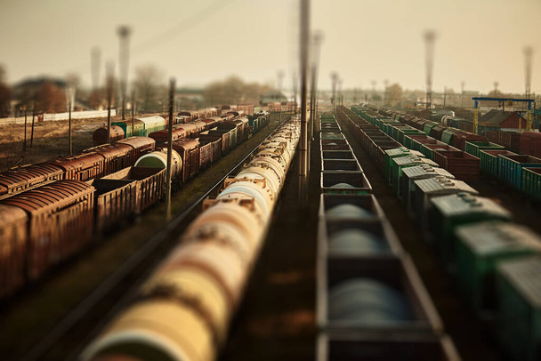 Freight railway cars at the railway station. Top view of cargo trains.Wagons with goods on railroad. Heavy industry. Industrial conceptual scene with trains. selective focus. - Photo, Image