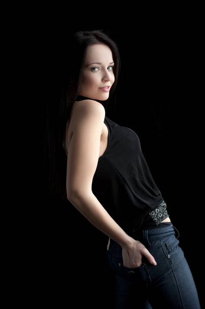 Beautiful sexy brunette girl posing on a black background - Fotoğraf, Görsel