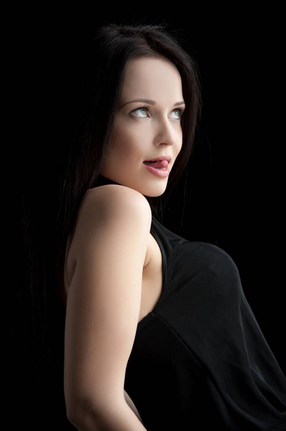 Beautiful sexy brunette girl posing on a black background - Foto, Imagem