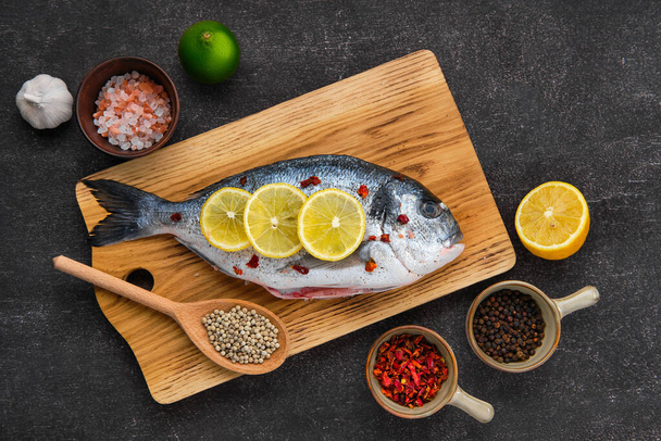 Overhead view of gilt head bream with spice prepared for cooking - Fotoğraf, Görsel
