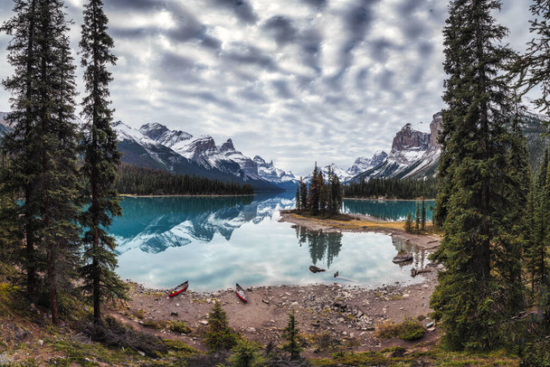 Spirit Island with Canadian rockies on Maligne Lake in autumn forest at Jasper national park, Canada - Photo, Image