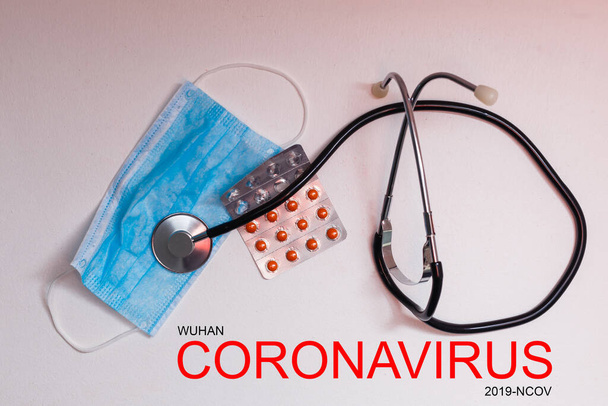 Novel coronavirus disease 2019-nCoV written. Many pills and stethoscope. - Fotó, kép