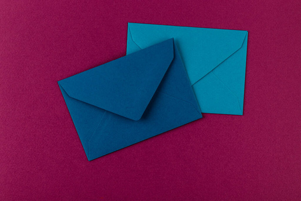 Colorful envelopes on a purple background. Mail envelopes on the table. - Photo, image
