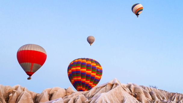 Hot air balloons preparing to fly at early morning in winter season in Cappadocia, Turkey - Zdjęcie, obraz