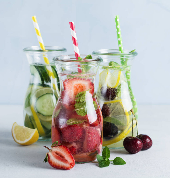 Refreshing summer homemade cocktail in glass bottles. Detox fresh water. Selective focus. Copy space. - Foto, Imagem