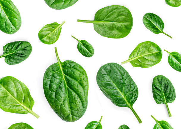 Spinach Pattern. Creative layout made of spinach leaves isolated on white background. Flat lay. Healthy Food concept. - Valokuva, kuva