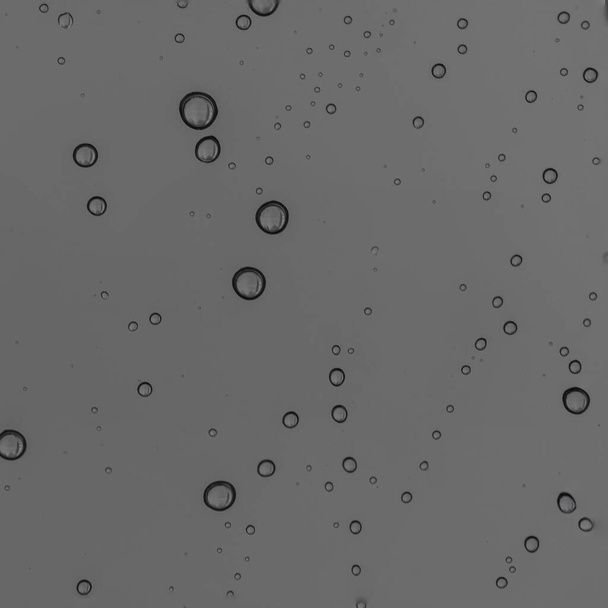 Rain water drops  on clear window.  Natural Pattern of raindrops. Autumn  depressive background - Photo, Image
