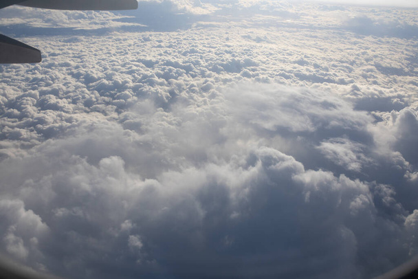 Flying high in the sky among the clouds. - Foto, Bild