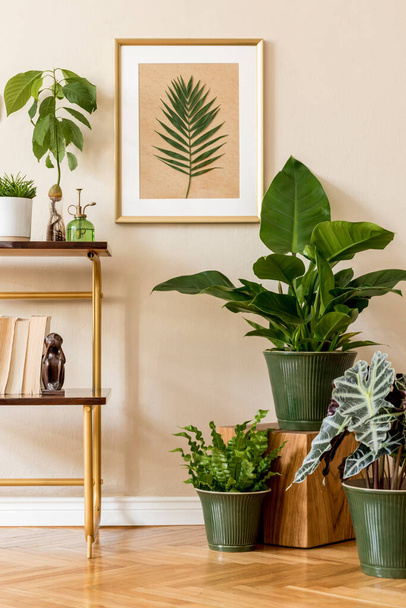 Stylish drawing and green plants in retro studio, interior design - Foto, imagen