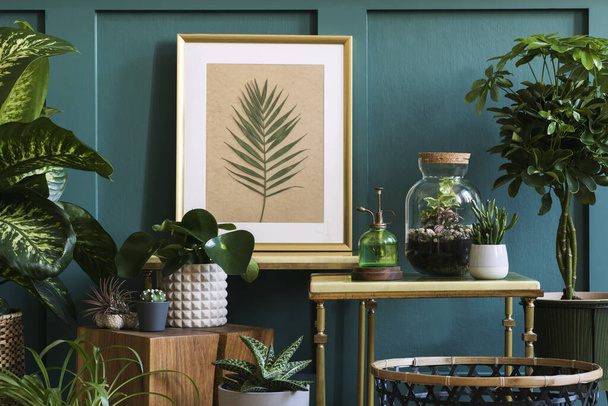 Stylish drawing and green plants in retro studio, interior design - Foto, immagini