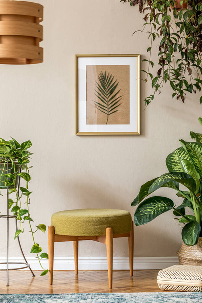Stylish room design with vintage commode, potted plants and beautiful drawings - Photo, image