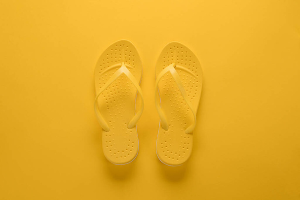 Flip flops on yellow background - Fotografie, Obrázek