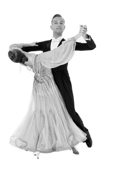 ballrom dance couple in a dance pose isolated on black background - 写真・画像
