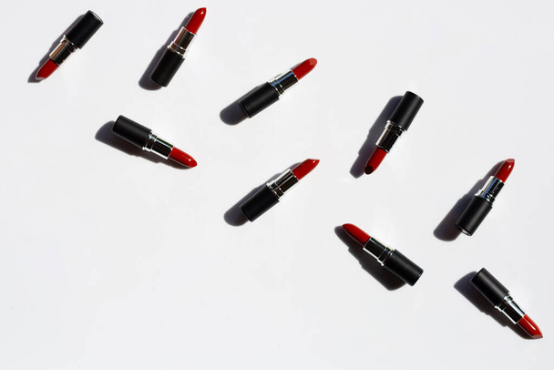 Flat lay composition, Lipsticks on white background with shadow. Beautiful Make-up concept - Photo, Image