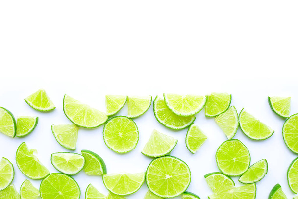 Fresh lime slices on white background. Copy space - Foto, imagen