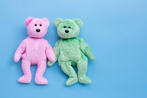 Bear toy couple on blue background. Copy space - Photo, Image