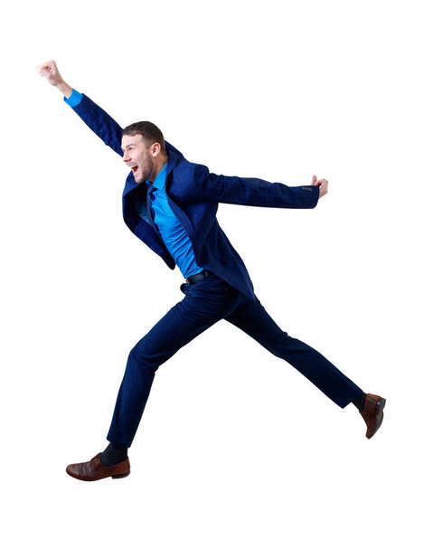 Full length happy businessman jumping forward in the air. - Photo, Image