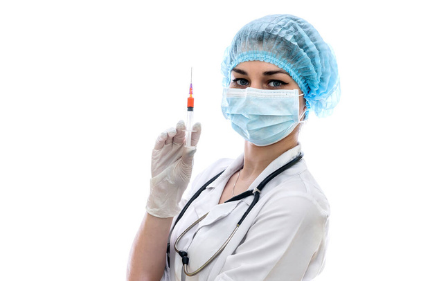 Doctor in mask with syringe isolated on white - Fotó, kép