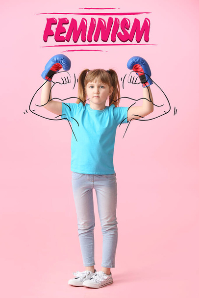 Little girl in boxing gloves on color background. Concept of feminism - Photo, Image