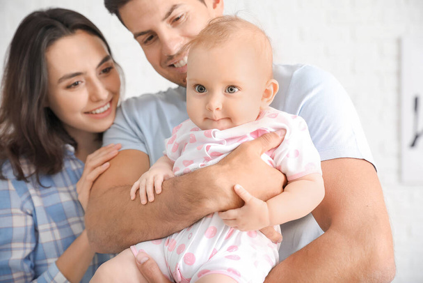 Cute baby with parents at home - Foto, imagen