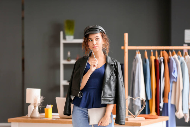 Portrait of female clothes stylist in office - Foto, Imagem