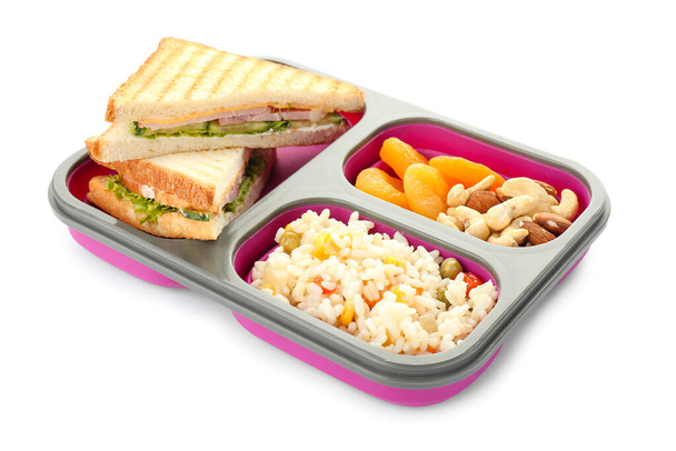 Scatola pranzo scuola con cibo gustoso su sfondo bianco
 - Foto, immagini