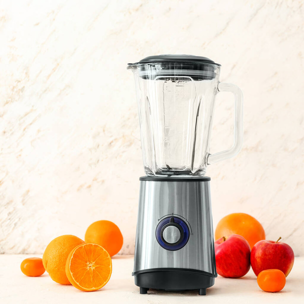 Blender with ingredients for healthy smoothie on table - Foto, Imagen