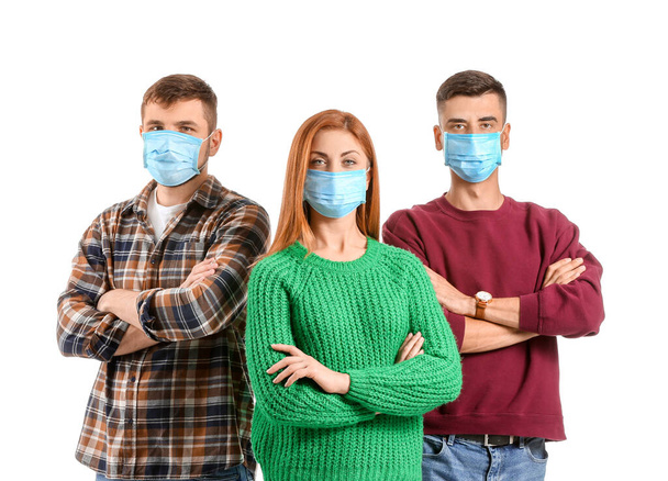 Group of people with protective masks on white background. Concept of epidemic - Photo, Image