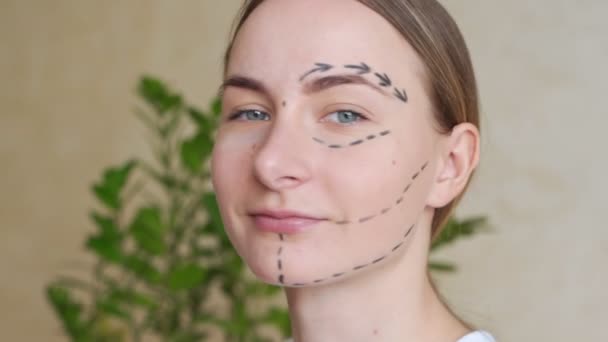 Woman with dotted lines on face, cosmetology - Imágenes, Vídeo