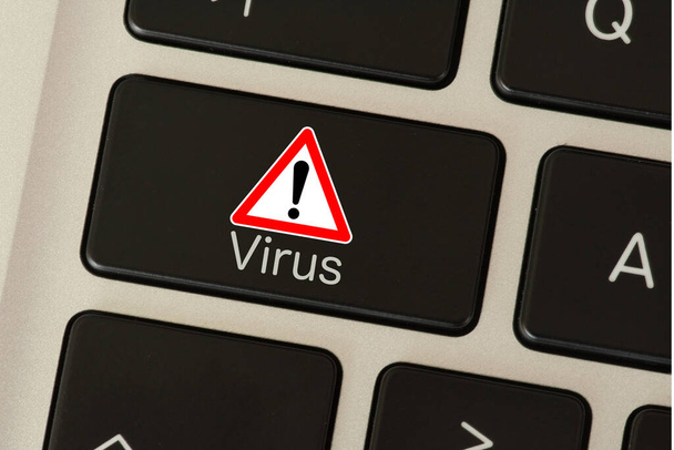 A computer and key labeled Virus - Photo, Image